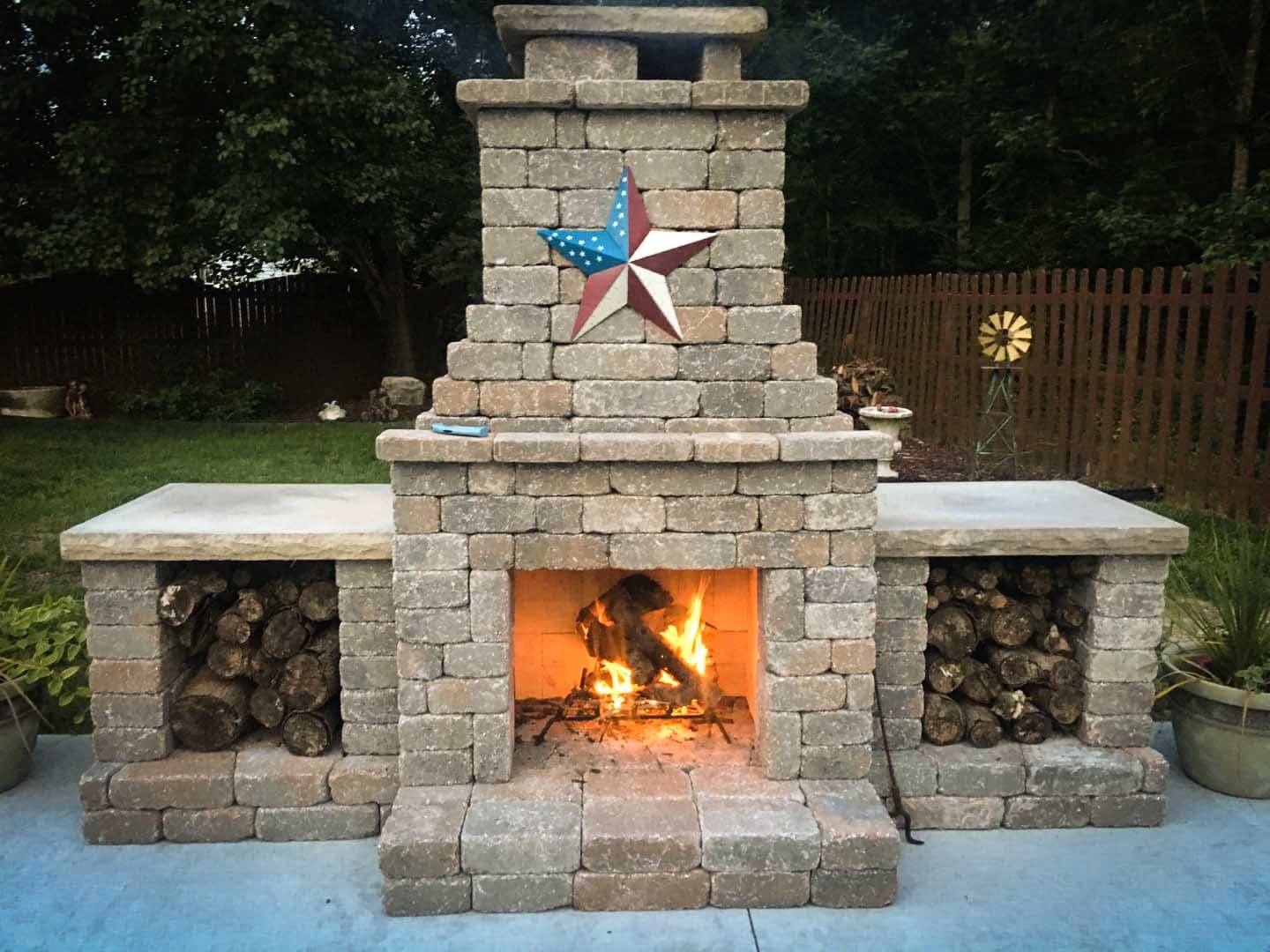 Fremont outdoor fireplace with wood storage boxes